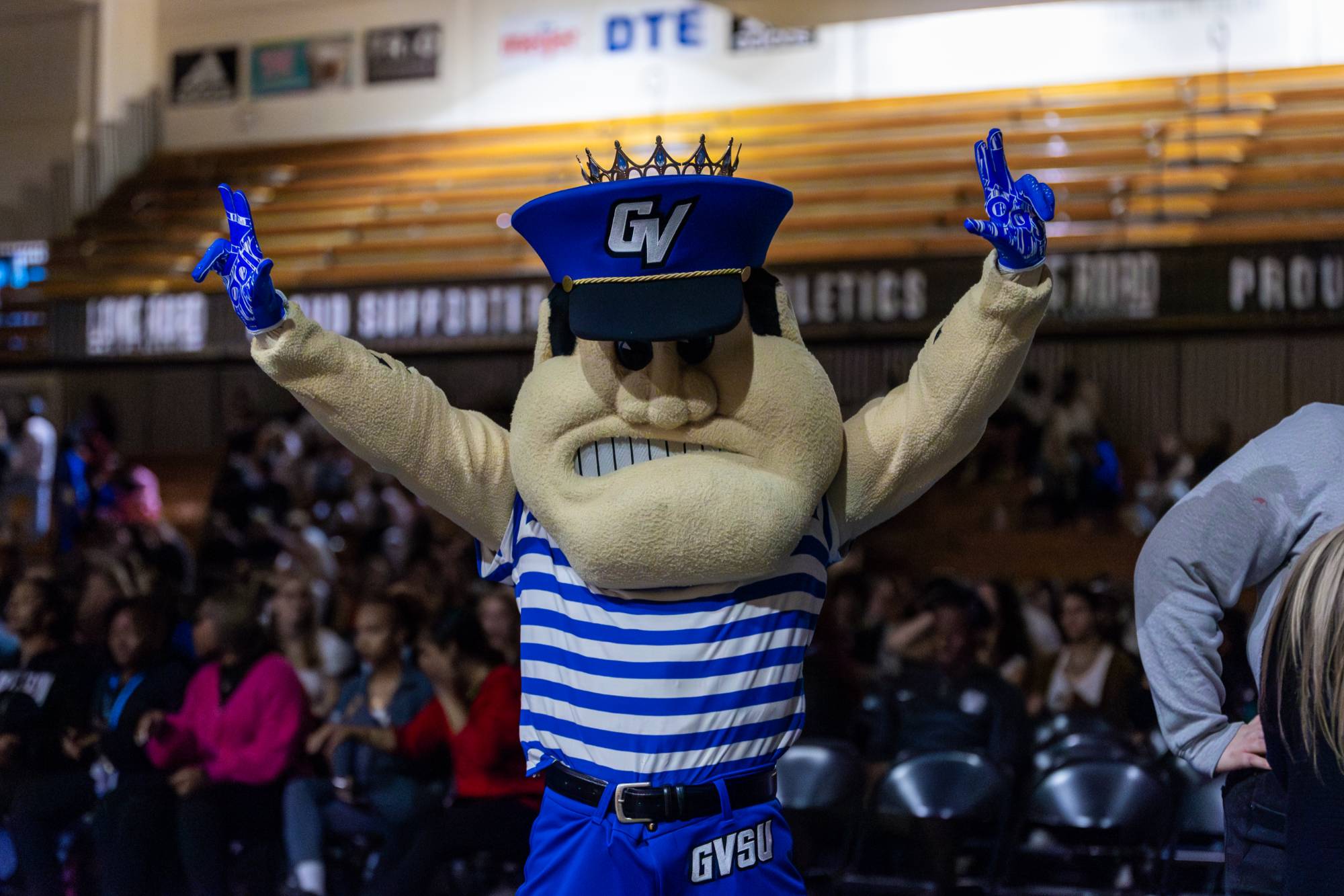 mascot Louie the Laker holding Homecoming crown